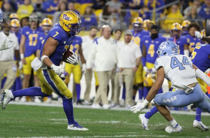 Pitt tight end Lucas Krull (7) runs after a catch as North Carolina linebacker Jeremiah Gemmel (44) defends. Mandatory Credit: Charles LeClaire-USA TODAY Sports